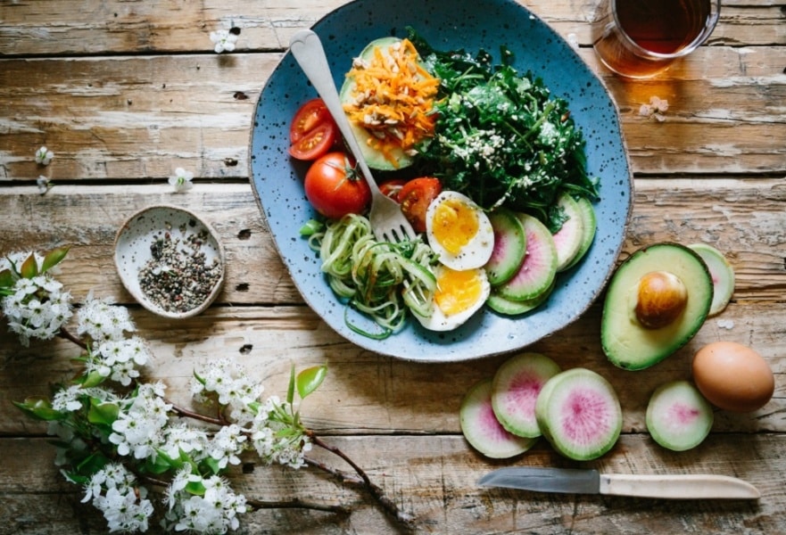 Colorful salad on a wooden table.