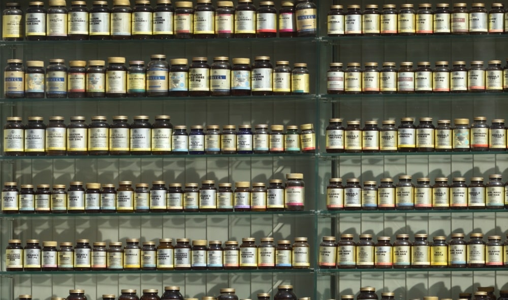 Pill bottles lined up on shelves.
