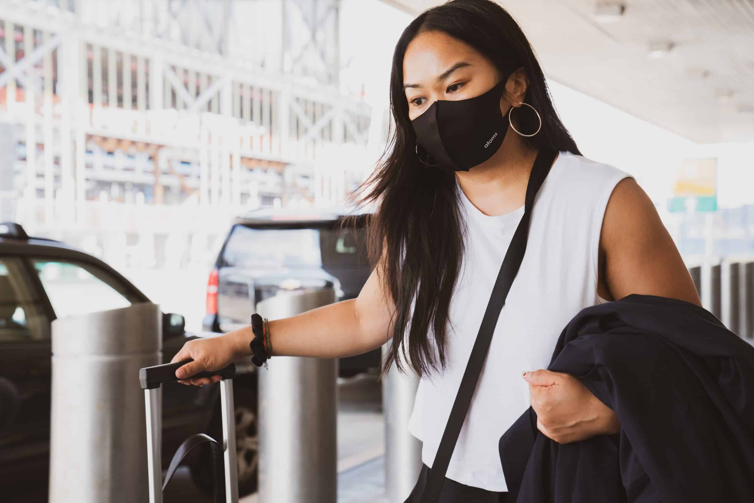 Woman wearing mask in airport.