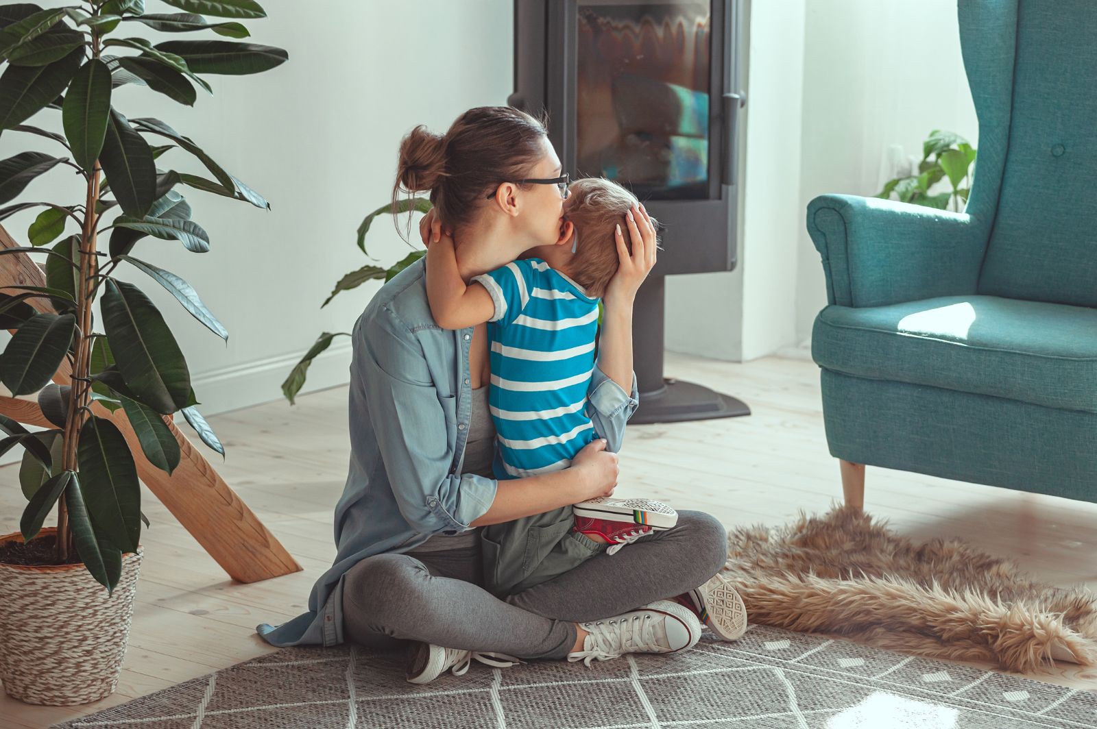woman hugging young child