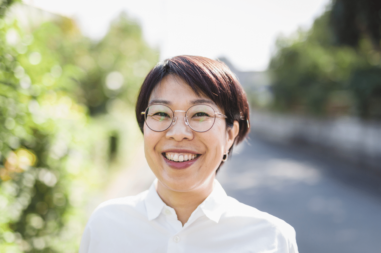 Woman with pixie cut and glasses