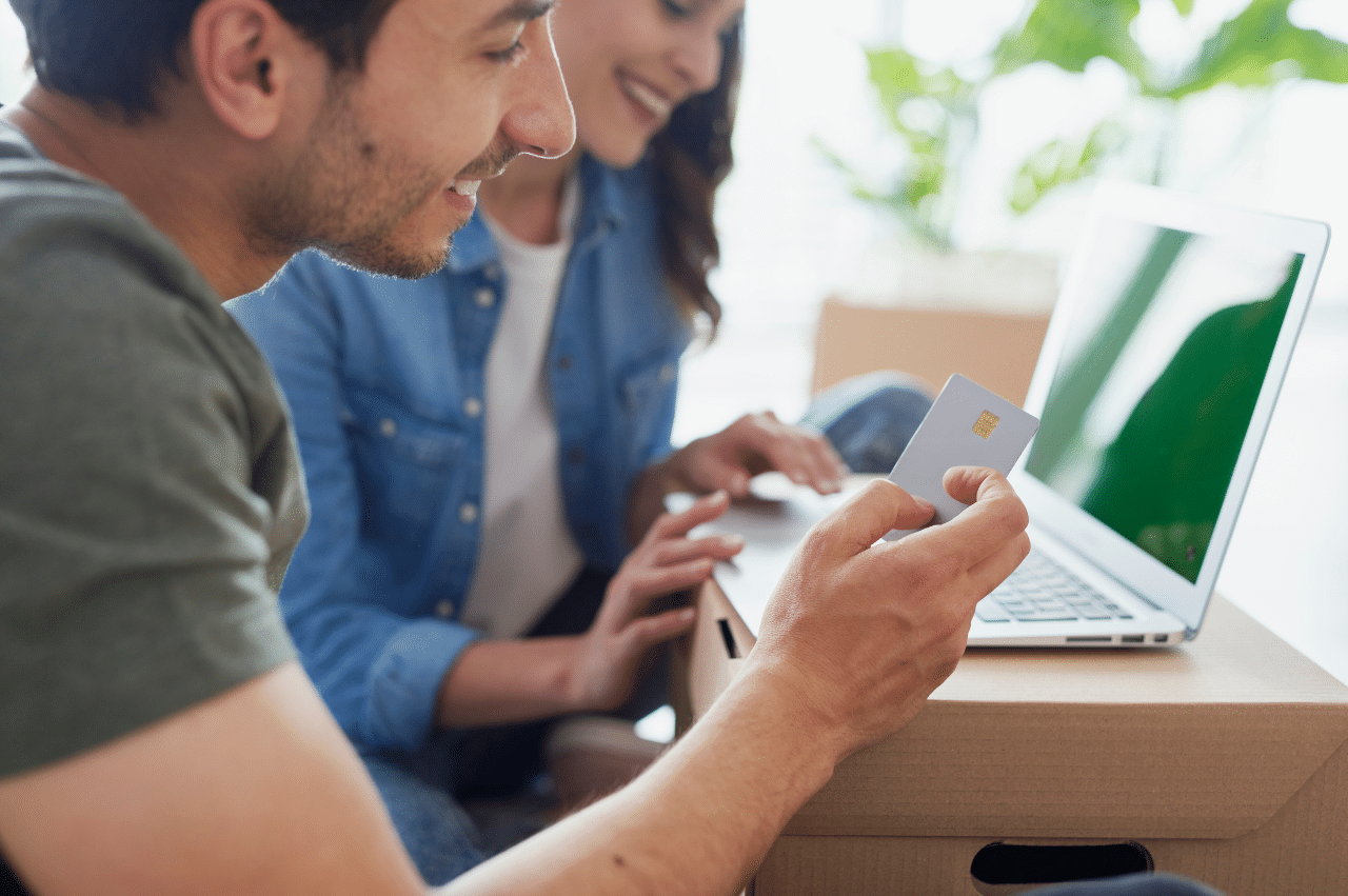 Photo of a couple looking at a laptop
