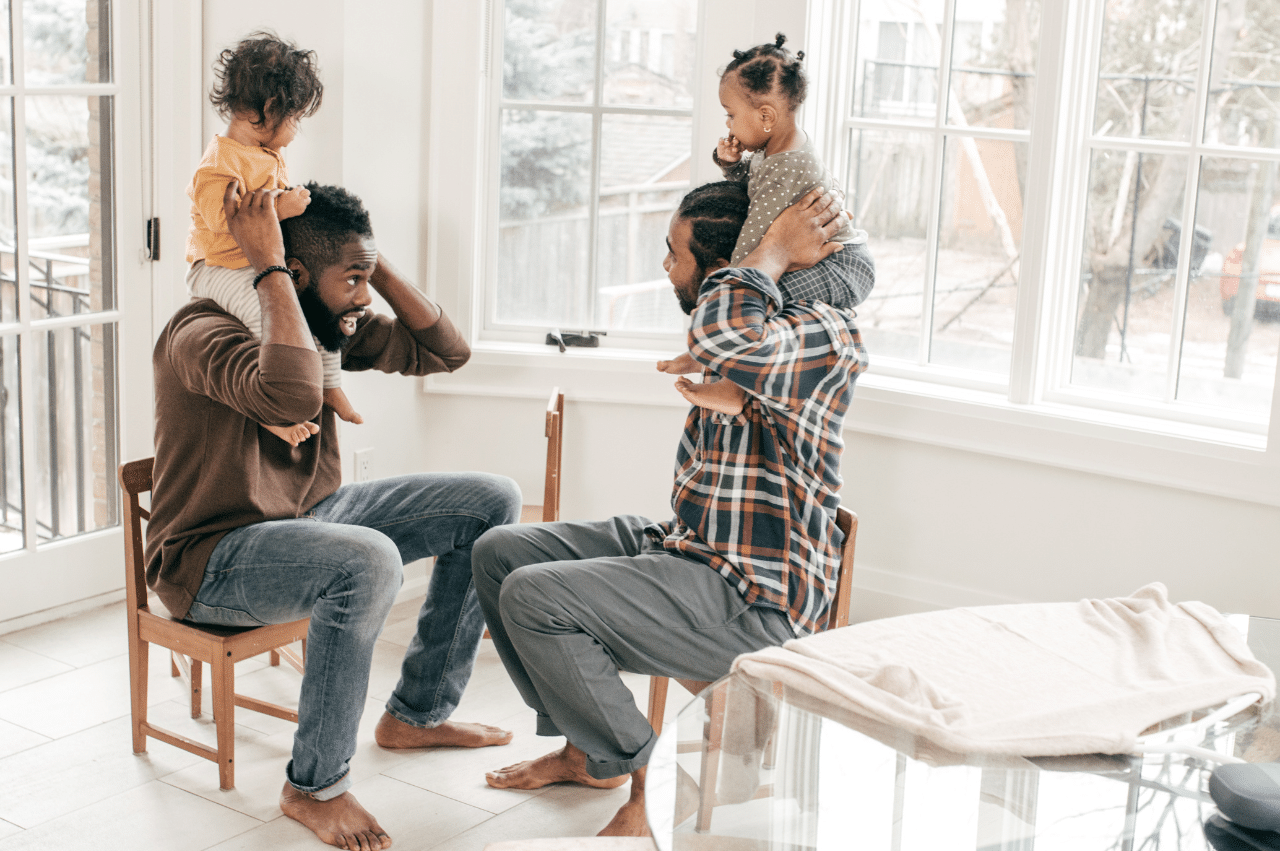 Photo of two fathers sitting at a table