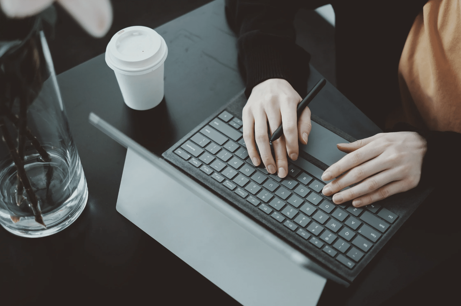 Green background with a woman holding a bullhorn and the words "How to Score Egg Freezing Discounts"