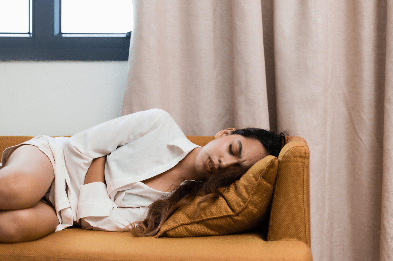 Photo of a woman laying on a couch